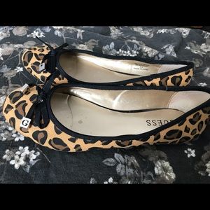 One of the shoes is missing a g off the bow